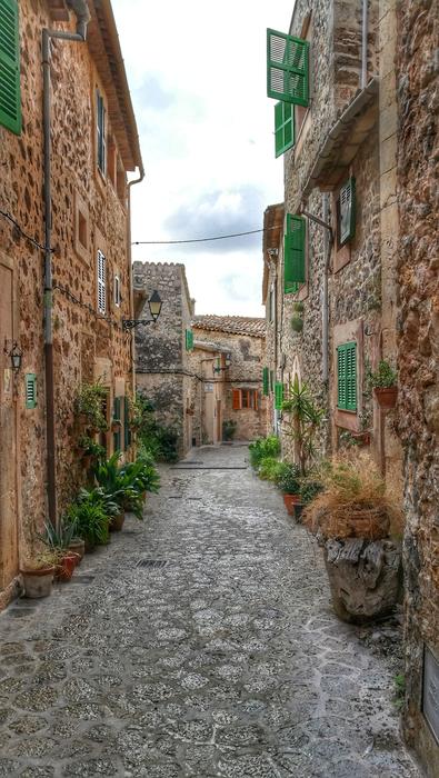 traditional architecture on a street in Valldemossa