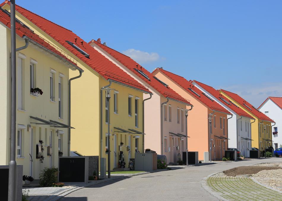Beautiful and colorful house, in the row, in light, near the road