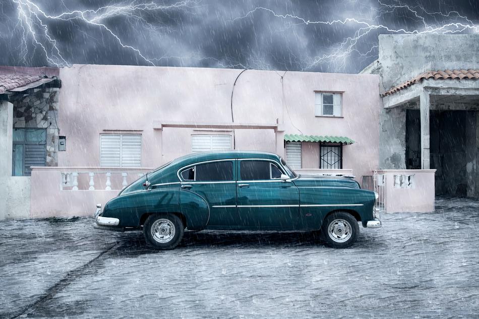 storm over classic car in havana