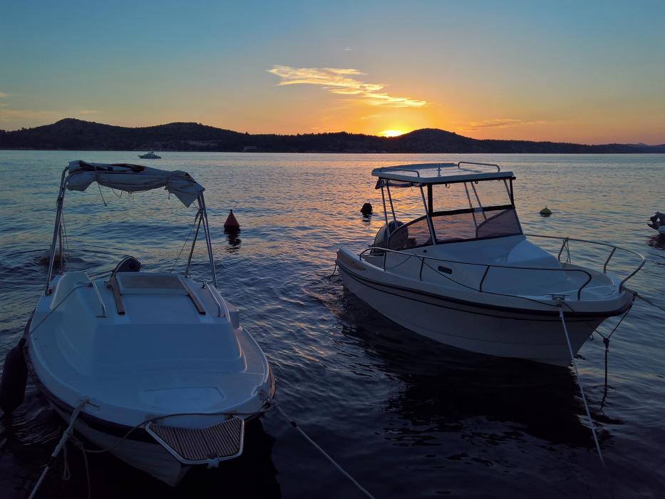 boats on the dock at dusk