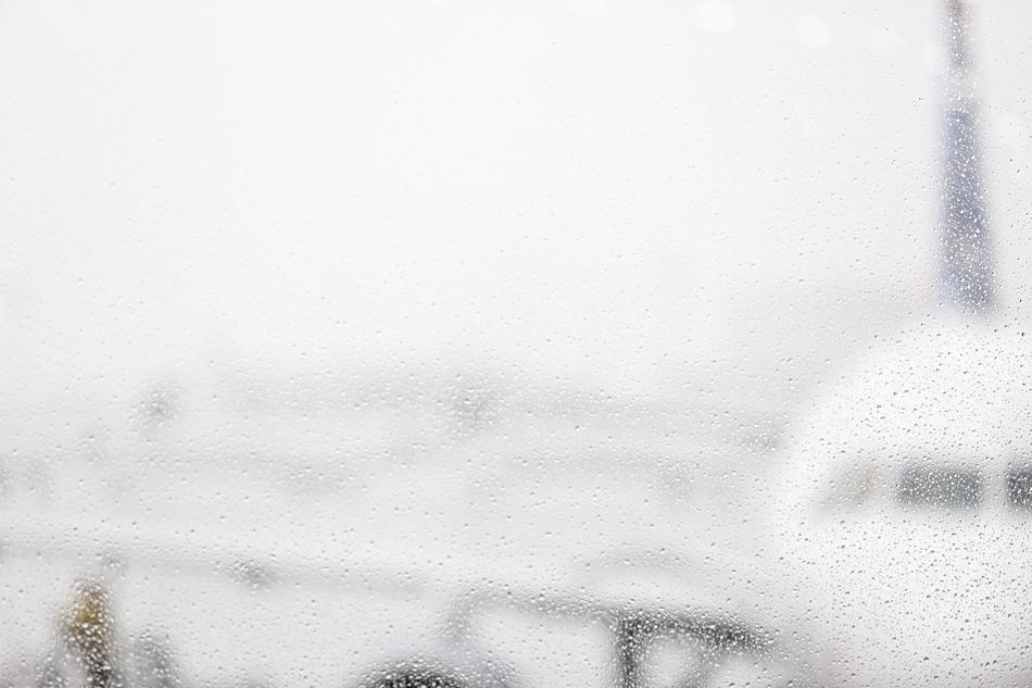 view of the plane through the raindrops