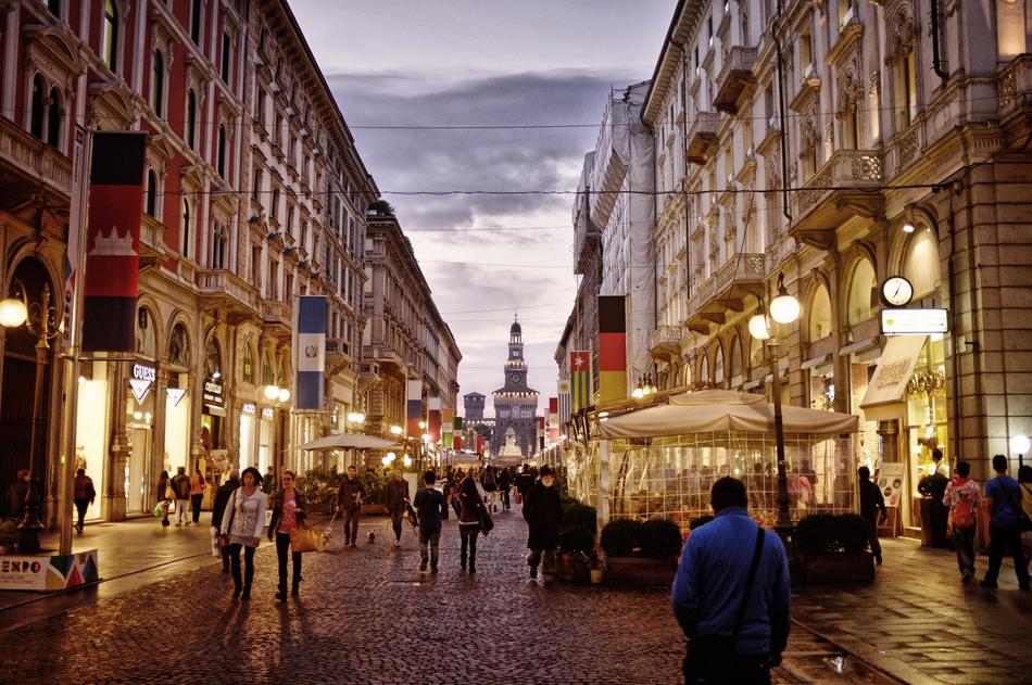 People in the beautiful city centre of Milan with colorful lights in Italy