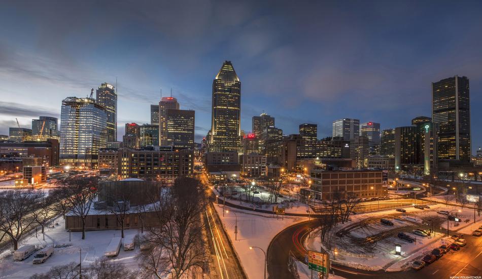 Beautiful Montreal cityscape in Canada with colorful lights in snow in winter