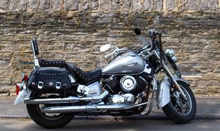 classic biker motorcycle on a stone wall background