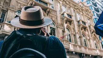 Man with the hat, taking a photo of the beautiful architecture