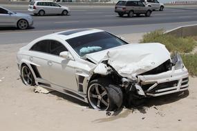 Road trash white car