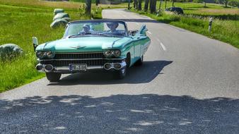 retro car mint color on the road