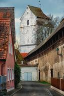 Beautiful street with the top of the water tower in NÃ¶rdlingen, Germany