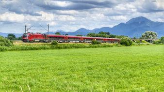 Panorama view of Field Grass and red train