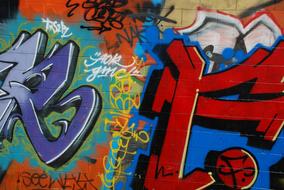 Close-up of the colorful graffities, with the signs, on the wall