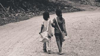 monochrome photo of Kids Girls walking