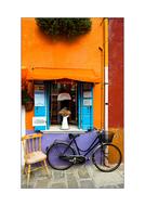 Black bike, near the colorful and beautiful building, on the street