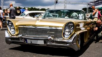 golden classic car on show