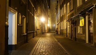 narrow street of the old town in the night illumination