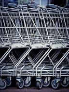 metal trolleys in a supermarket close up