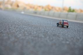 mini car on the asphalt in a blurred background