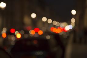 Night view with colorful bokeh lights of the car flow