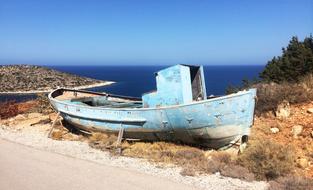 old wooden boat on the shore