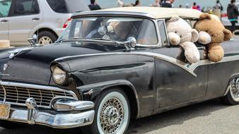 huge stuffed toys in a classic car