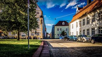 Beautiful and colorful Ingolstadt, Germany, with plants, in sunlight, under the blue sky with clouds