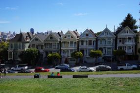 cars are parked near residential buildings