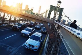 cars on the road under the bridge in brooklyn