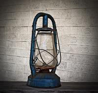 Old oil lamp at brick wall