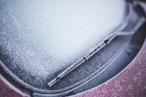 Frozen window of car close up