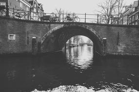 monochrome photo of Bridge Body Of Water River