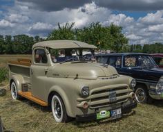 retro cars outdoors on a cloudy day