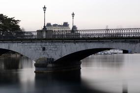 Beautiful MÃ¼nster Bridge above the water in MÃ¼nster Bridge, Zurich, Switzerland, in the evening