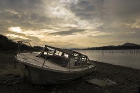 Beautiful landscape of the water shore with boat, near the mountains, in Landa Vitoria