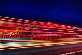 Traffic with colorful lights, in movement, at the night