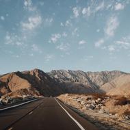 asphalt highway in the mountains on a sunny day