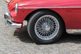 poke wheels in a red vintage car