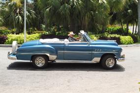 blue oldtimer on a sunny street in cuba