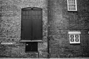 black and white, facade of an antique house