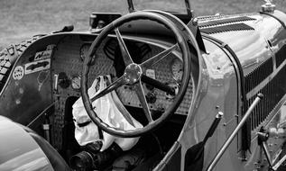 black and white photo of old car convertible