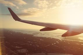 airplane wing at Sunset Sky Sunshine