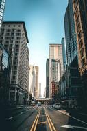 Cityscape of Chicago, Illinois, USA, with cars on the road, among the buildings