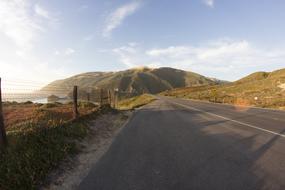 Beautiful landscape of the road among the colorful hills, in sunlight, in USA