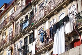 drying clothes on the facade of a house in the Porto