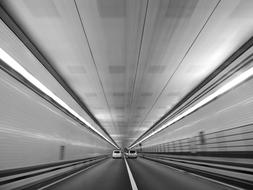 black and white photo of Road Tunnel Cars