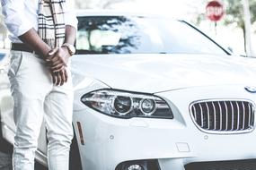 Man Standing Guy near white car