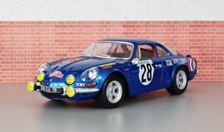 Shiny, colorful model of "Renault Alpine" car near the wall