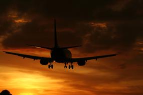 airplane in cloudy twilight