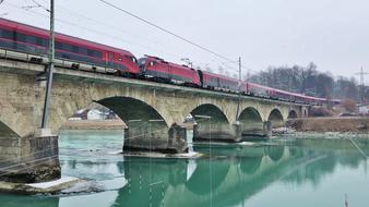 view of the train on the bridge over the river