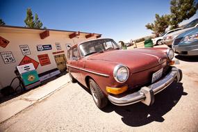 old car parked near a shop in america