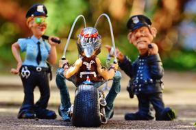 funny figures of two policemen and a biker