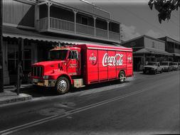 red coca cola truck in monochrome